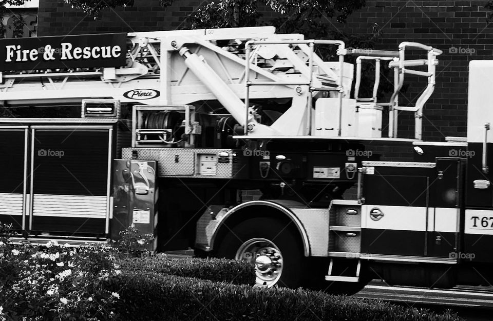 black and white profile view of a fire engine out on a neighborhood call in Oregon