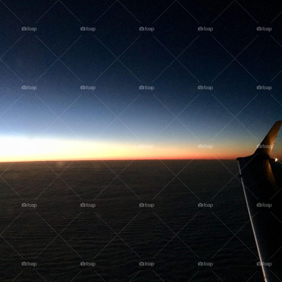 Sunrise in the Midwest from airplane