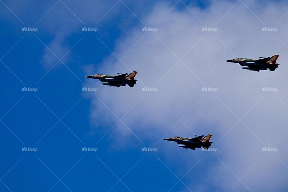 Three Fighters aircraft in blue sky with clouds on Independence Day 