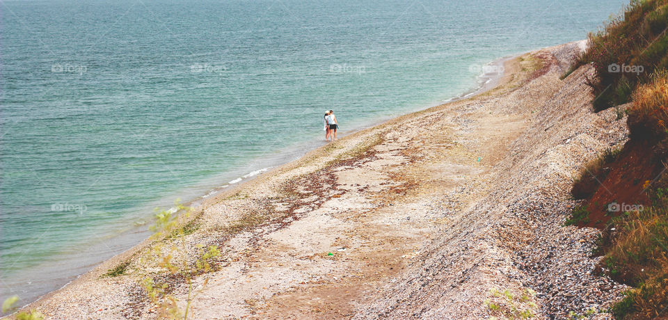 Couple walking on the beach