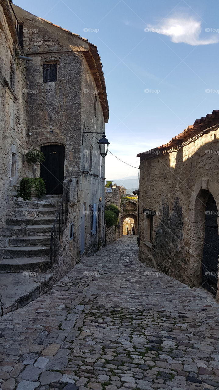 A narrow paved street in a Provencal village. France.