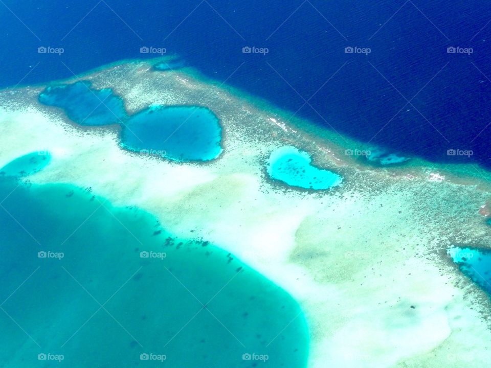 The perfect spot. Flying in a propeller-driven airplane was an exciting experience. Even more so, when looking down and seeing the beautiful little islands in the deep blue sea. 