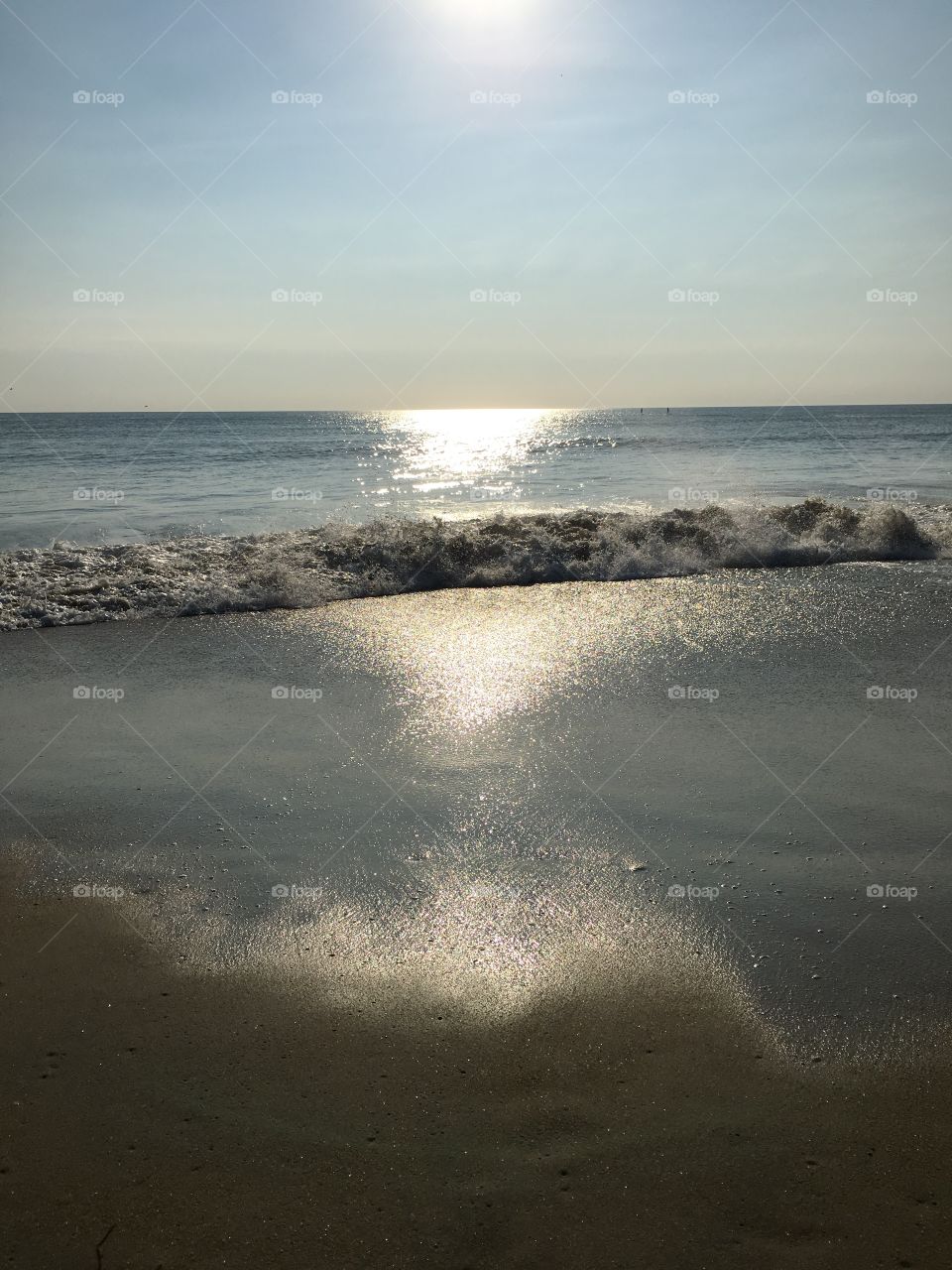 Sun reflected in the waves.