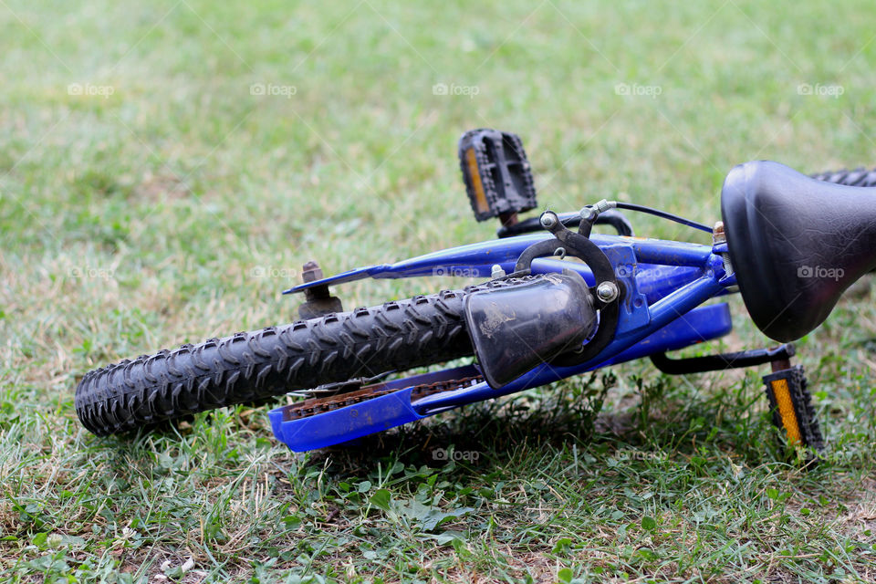 Blue bike on the grass, childhood freedom