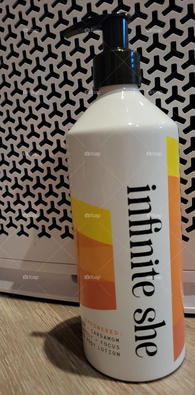 Margot Elena Infinite She empowered hydrating body lotion on black and white background