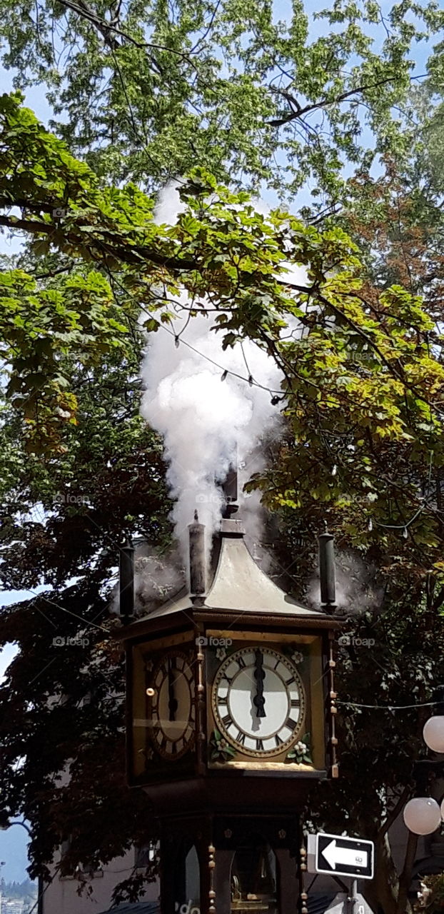famous gaztown clock in vancouver at noon