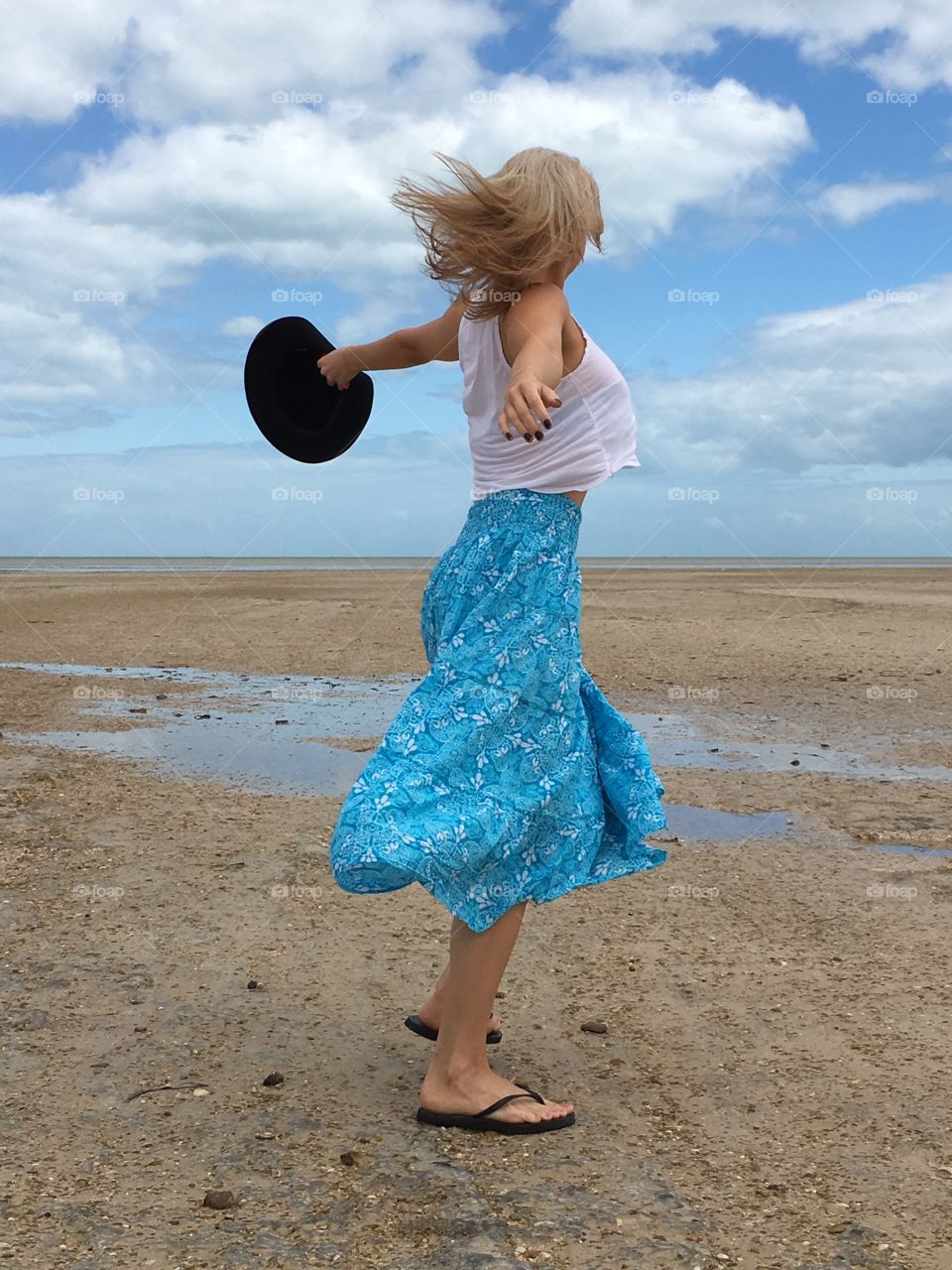 Artistic expression in dance on the beach at low tide 