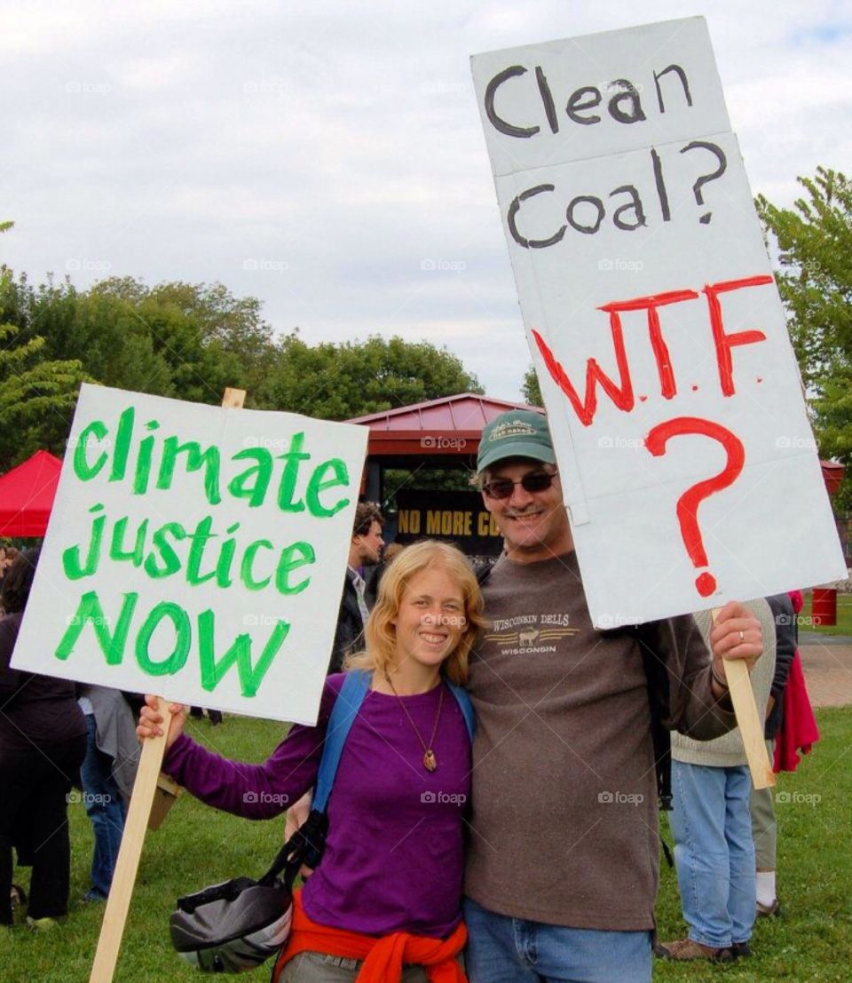 Climate change . Protest at coal refinery in Chicago area . Protesting against dirty air , pollution , health hazards poor neighborhood..
