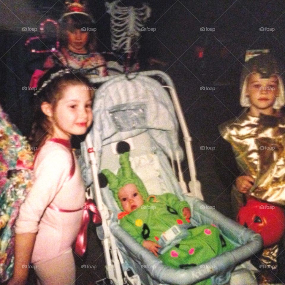Three kids in costumes 