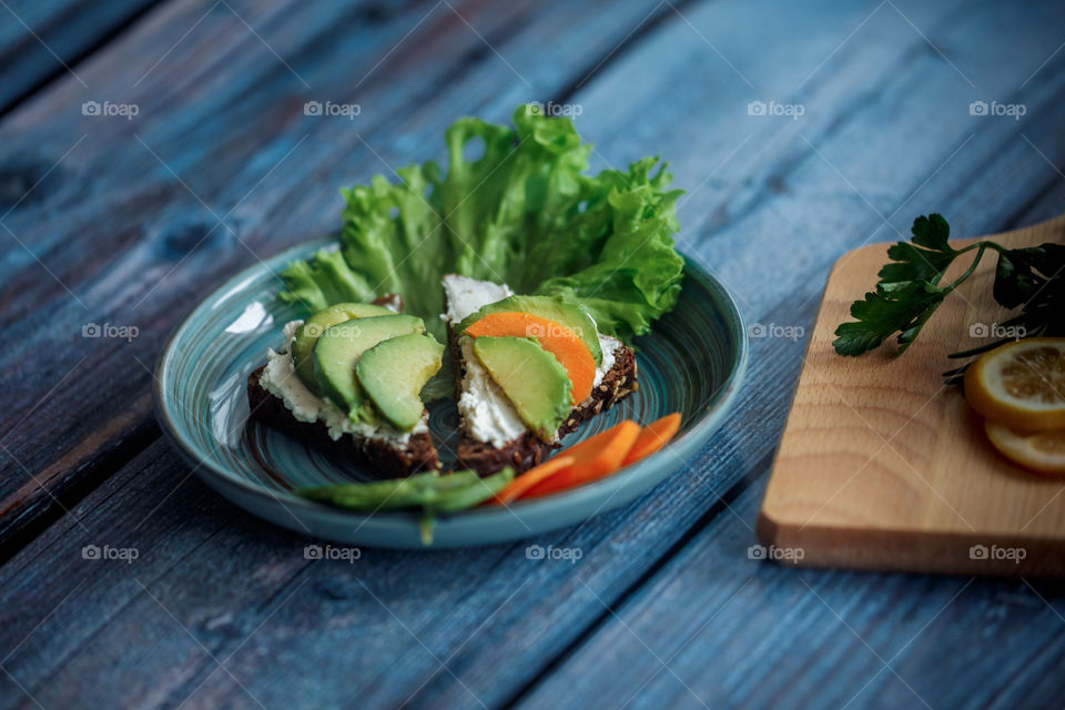 Dietary sandwiches with grain bread, cream cheese and avocado 