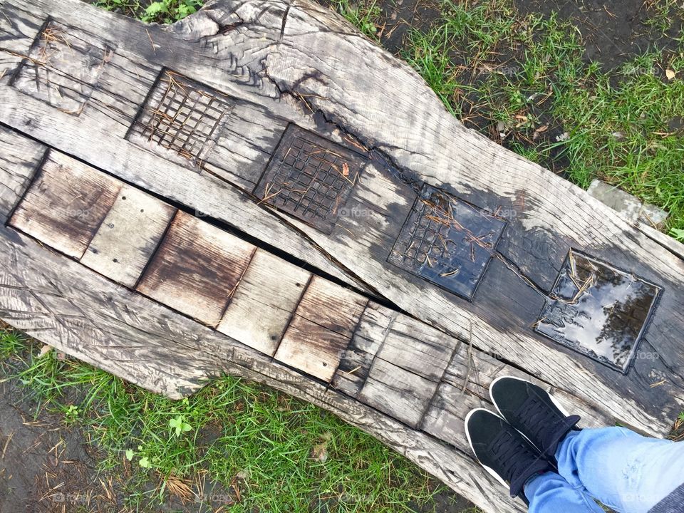 Standing on a wooden walkway with patterns