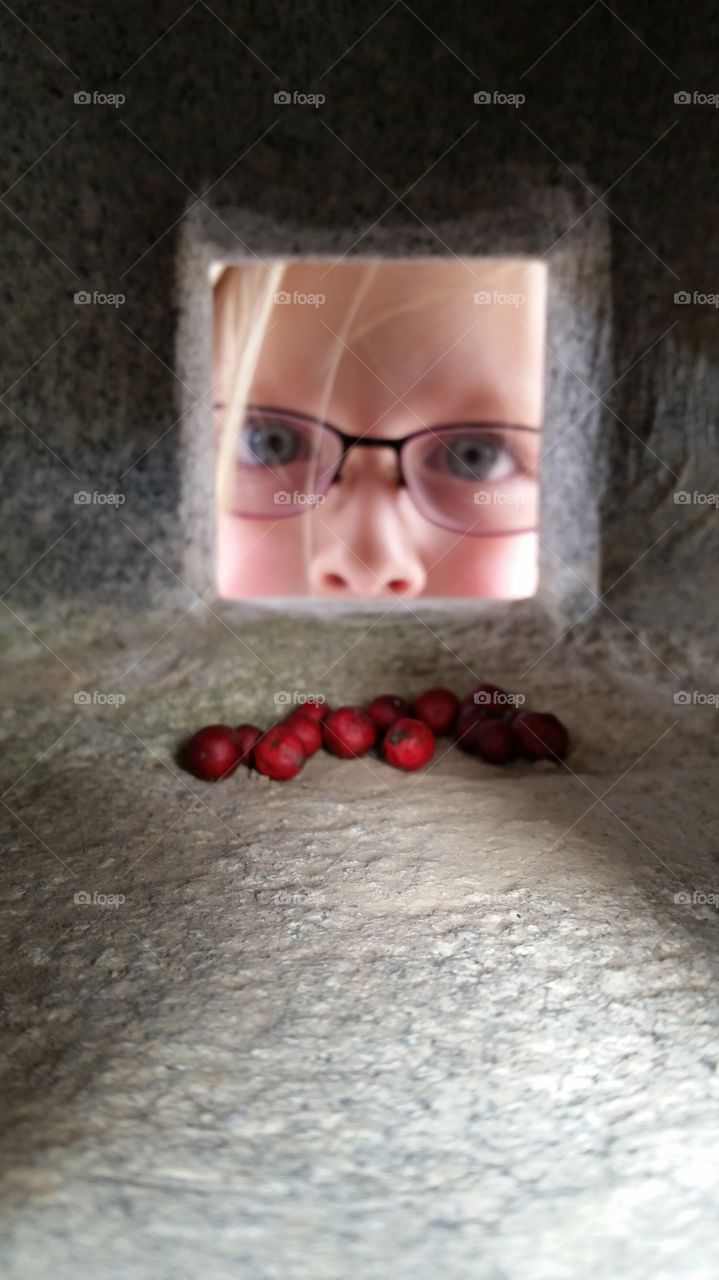 Peeking to see inside a statue! Fascinated and intrigued by her find!