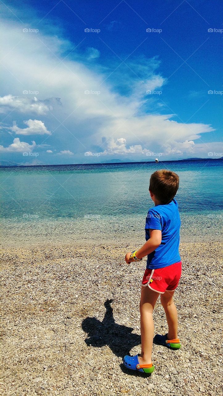 boy throwing a stone