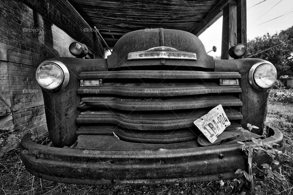 The grill of an old Chevy farm truck. 