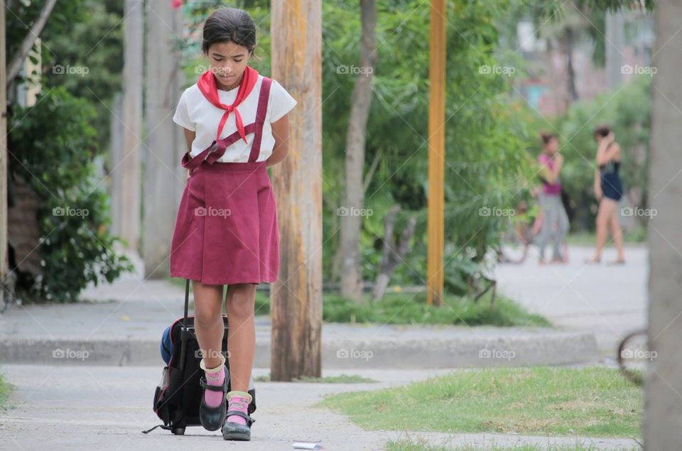 Young Girl On Her Way Back Home From School