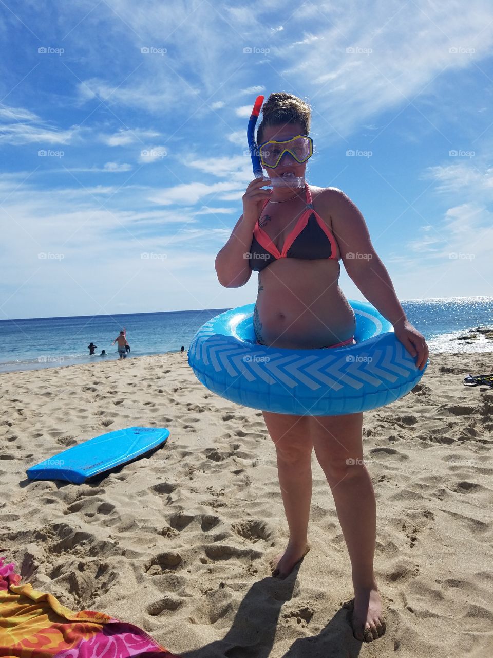 Lady on beach in snorkel gear