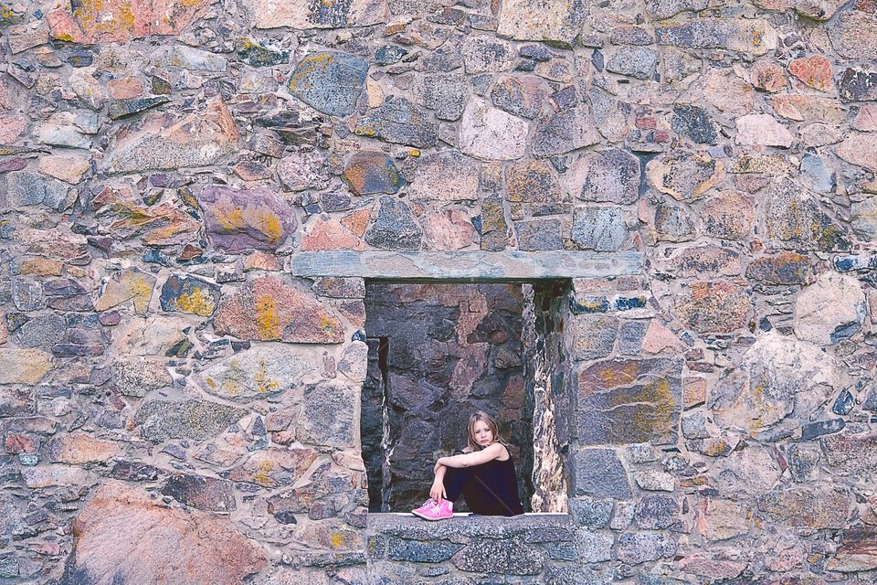 Girl sitting in a window