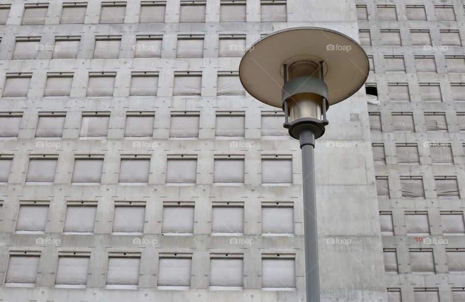 Street lamp on the grey wall background 