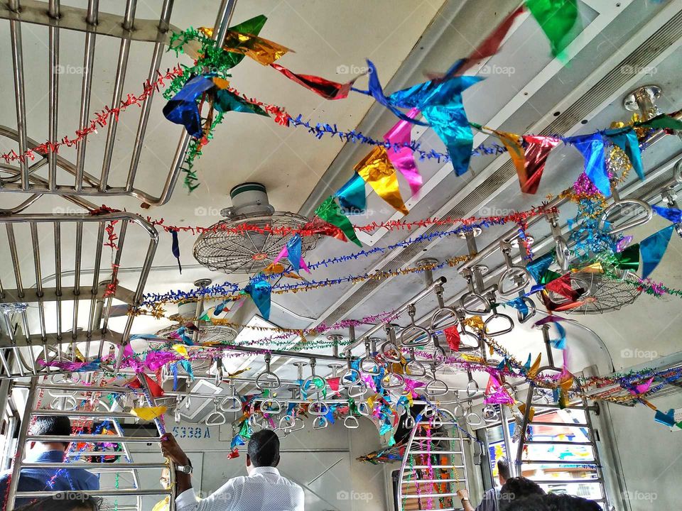 A local train during festival time in Mumbai India 2018.
