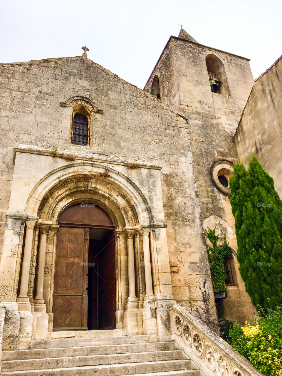 Ancient stone church in village square in Provence France