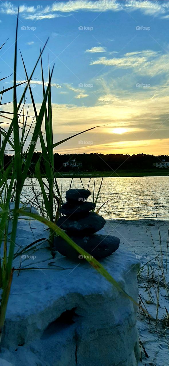 sun setting over the salt marsh