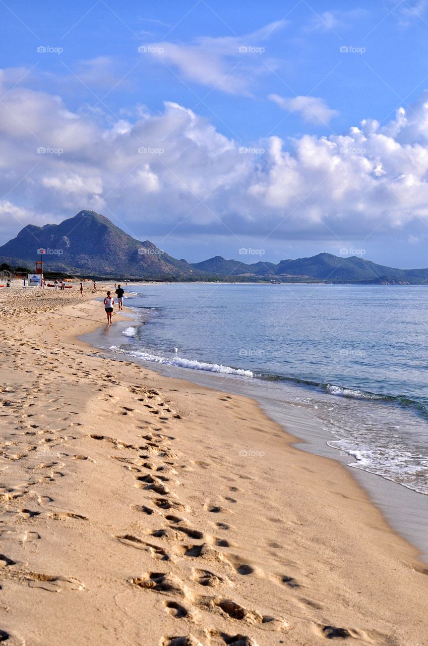 morning jogging in costa rei on sardinia island in italy