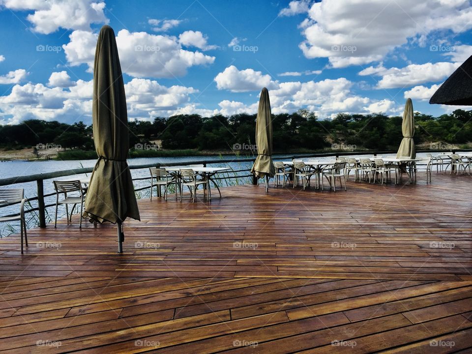 A wooden jetty like structure over the river at a Jetty restaurant.