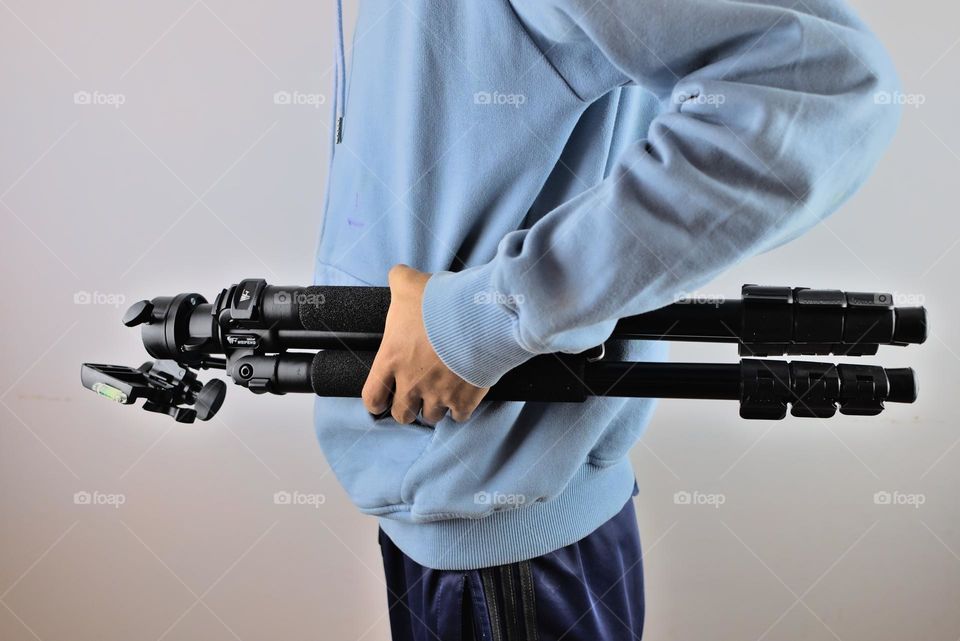 Tripod for video and photography in hands