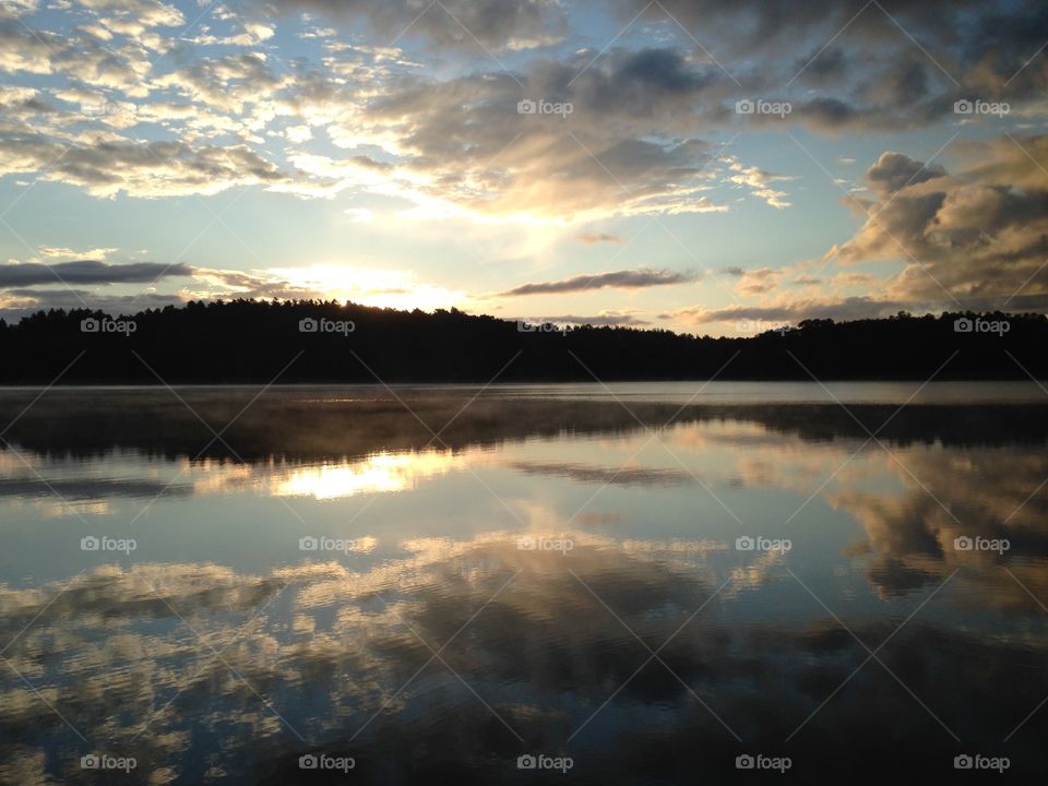 Reflection of cloudy sky in lake