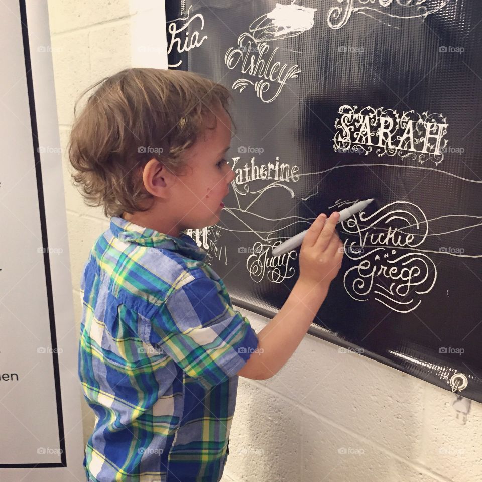 Ezra being inspired. . Drawing on a wall vinyl at my students BFA show. 