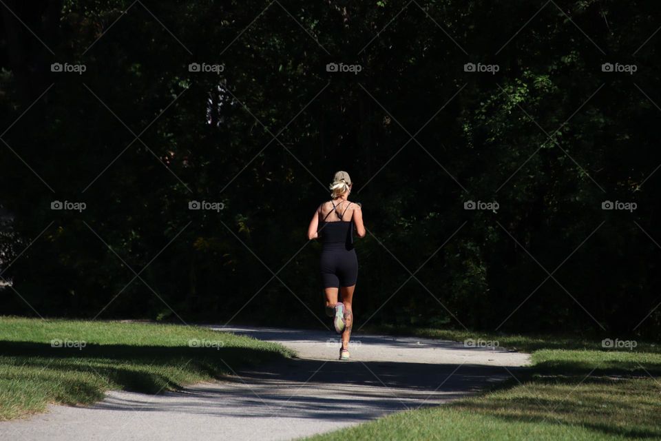 Woman is jogging in the park