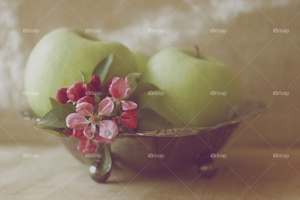 Green apple and flowers