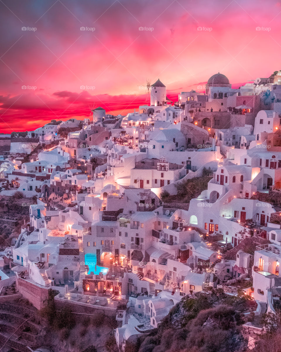 Amazing red sunset at Oia village in famous greek island Santorini in Europe.