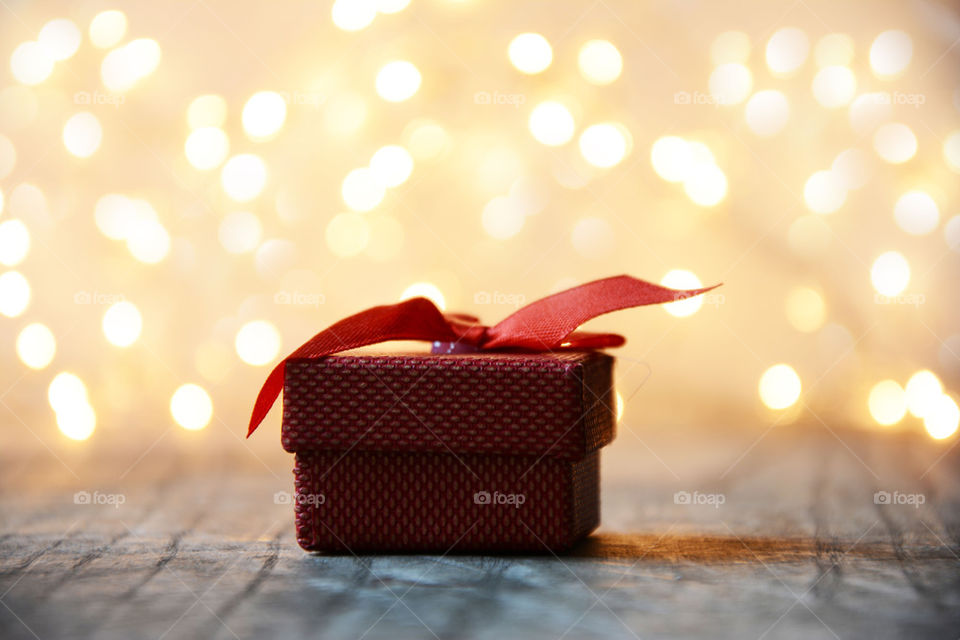 red gift box with bokeh