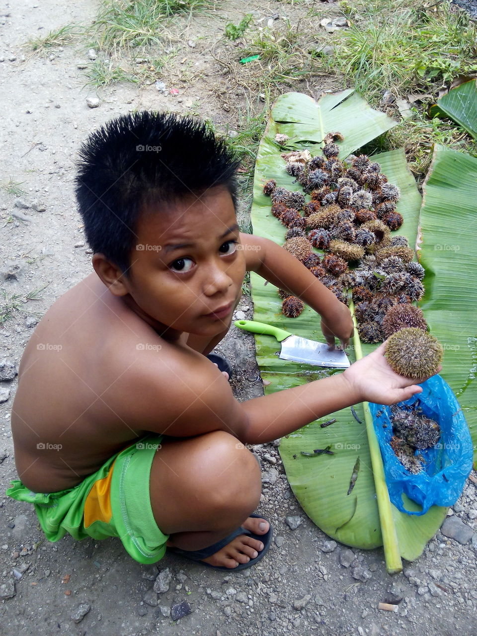 This is my son Coby. We are living in a small island called Siquijor in Philippines. We sorrounded by waters. The main occupation here is fishing so kids used to collect urchin in the seaside.