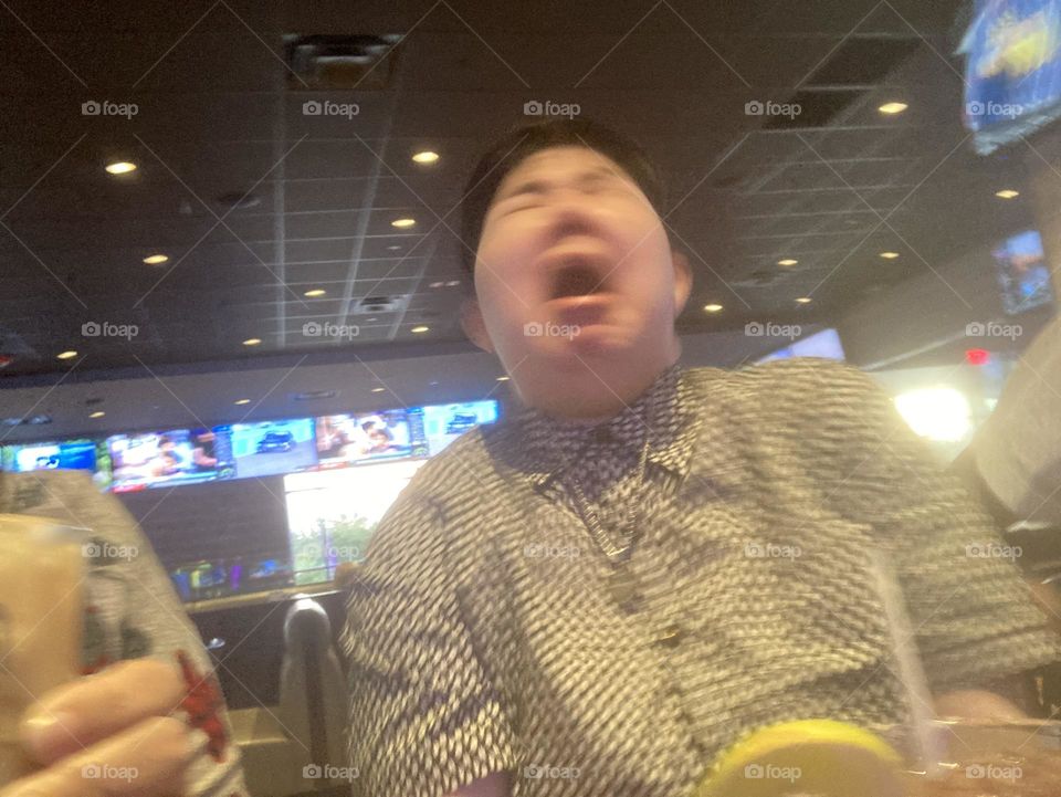 Face of a 21 year old drinking their first alcoholic drink 