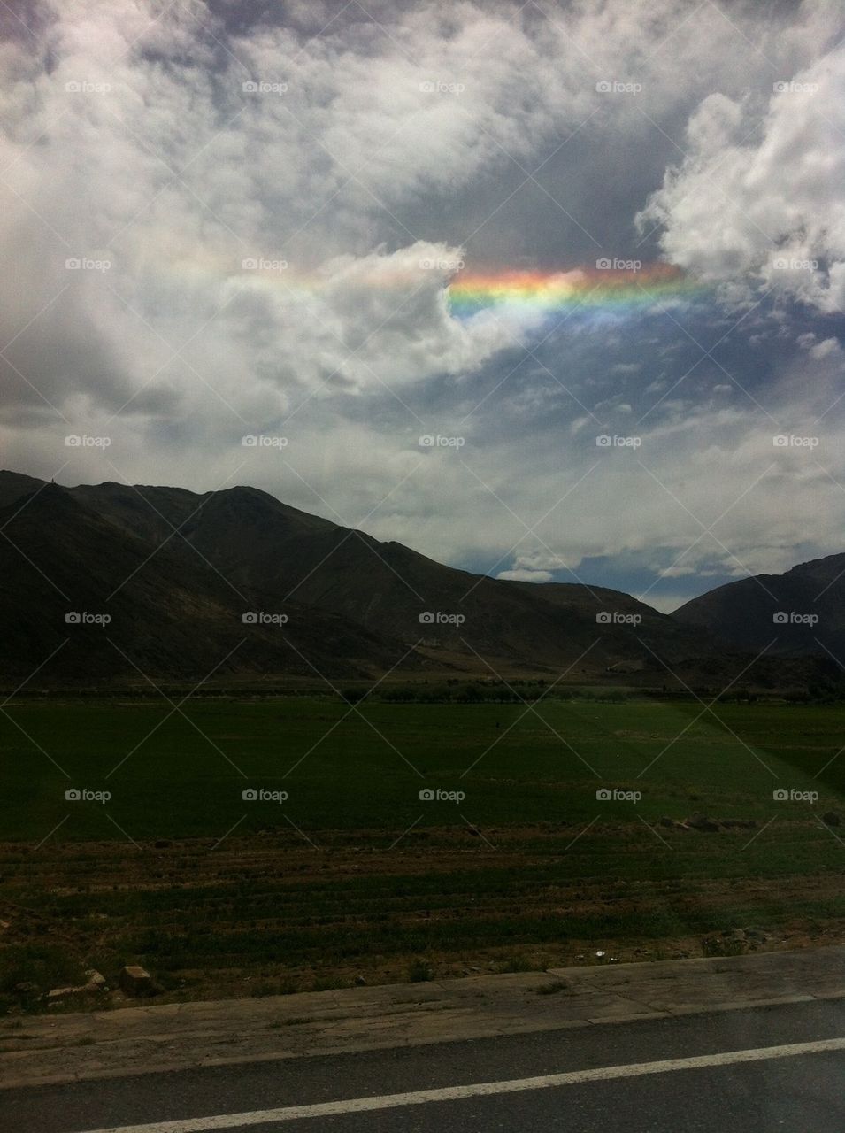 Rainbow in mountain range