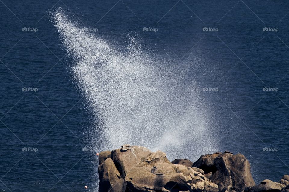waves crashing on rocks