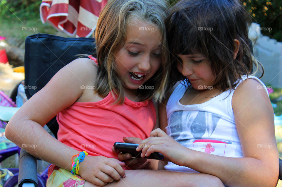 Summertime is about camping and just hanging out with your sister! My girls were snuggled together in a chair looking at their dad’s phone. They are never far away from the electronics; even when camping! Sigh! ⛺️