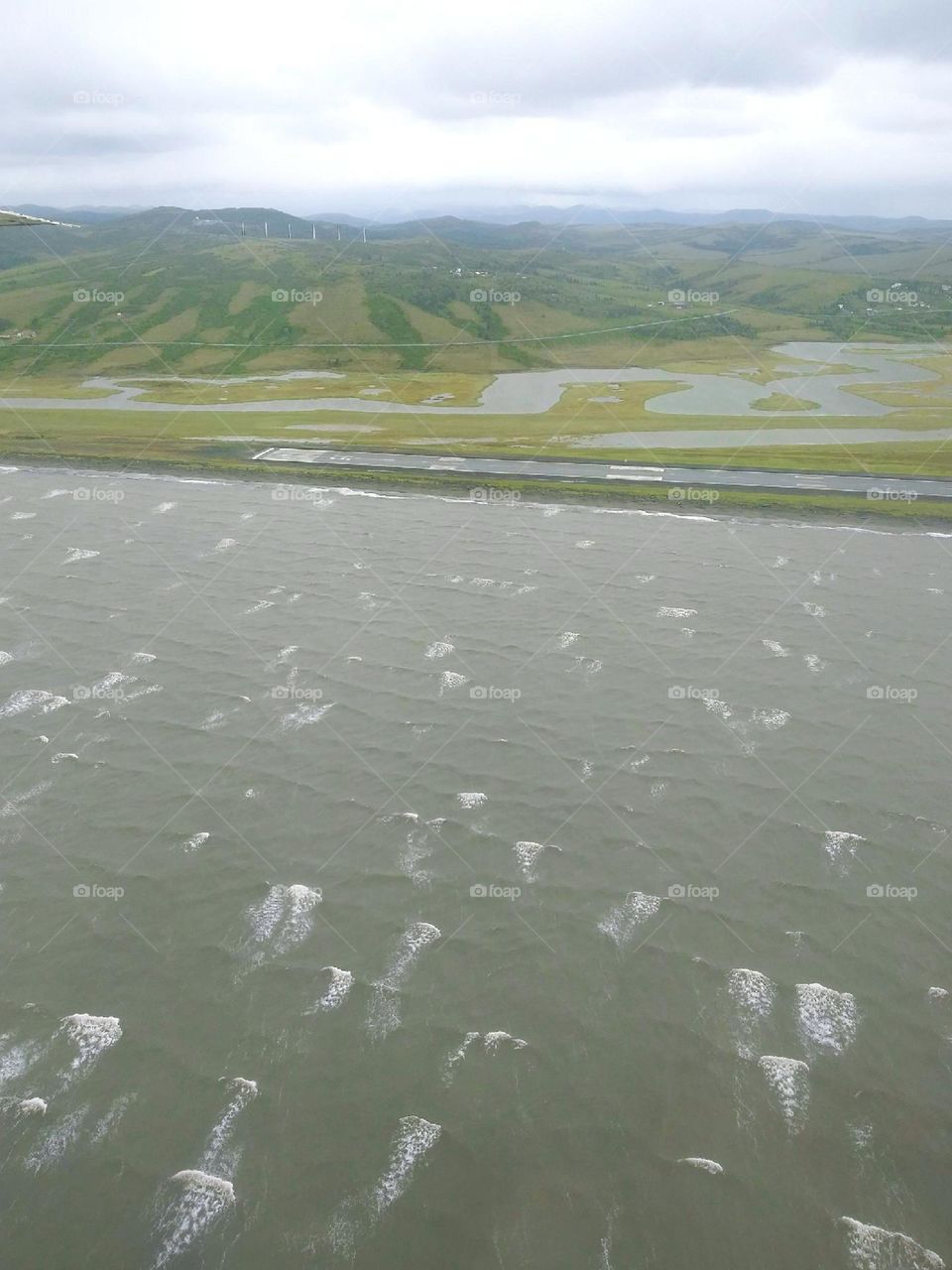 Bush Plane over Bering Sea