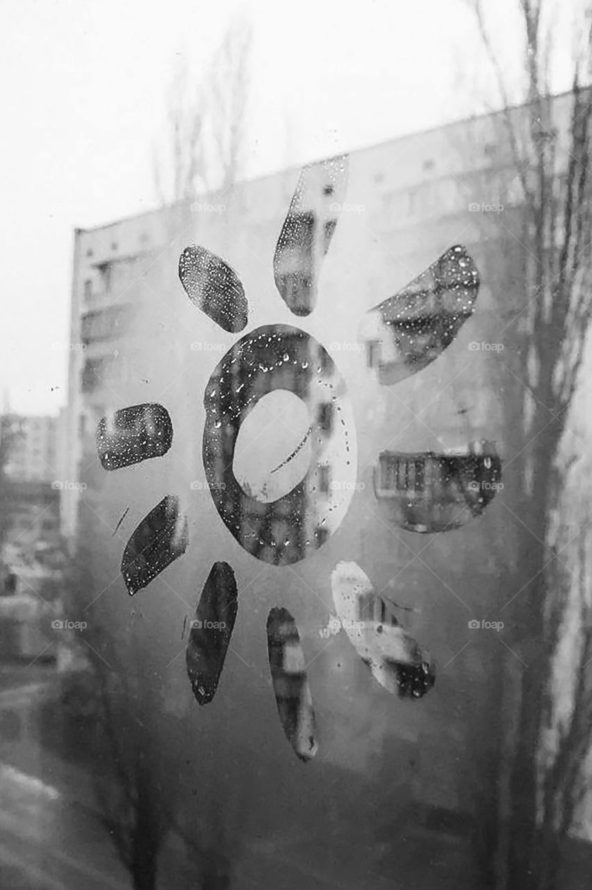 Sun drown on the window on the rainy day