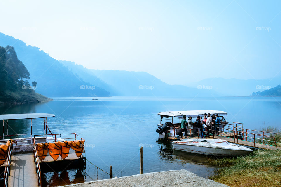 Umiam lake, shillong, Assam, India, December 15, 2017: Indian tourists people enjoying on travel holiday cruise boat tour.