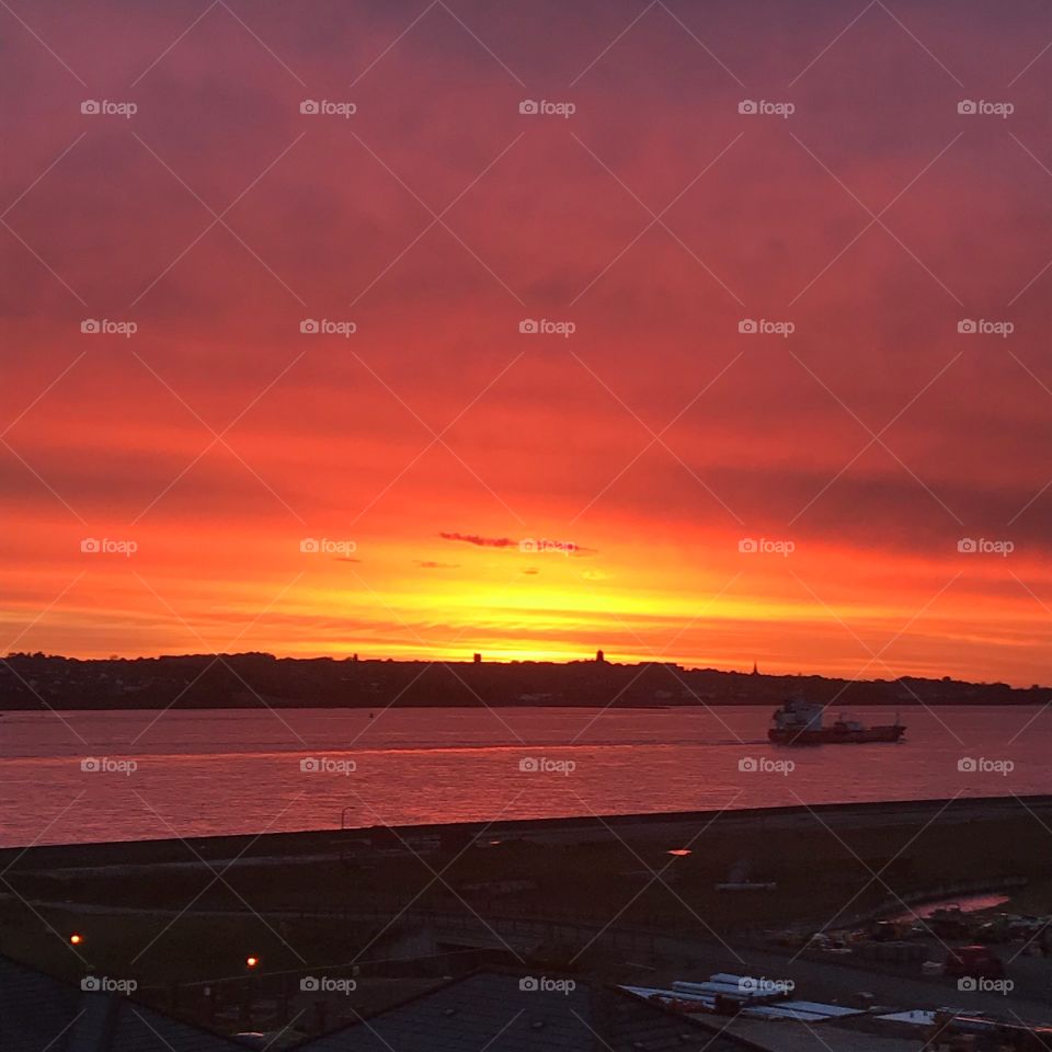 Sunset over the Mersey river in Liverpool