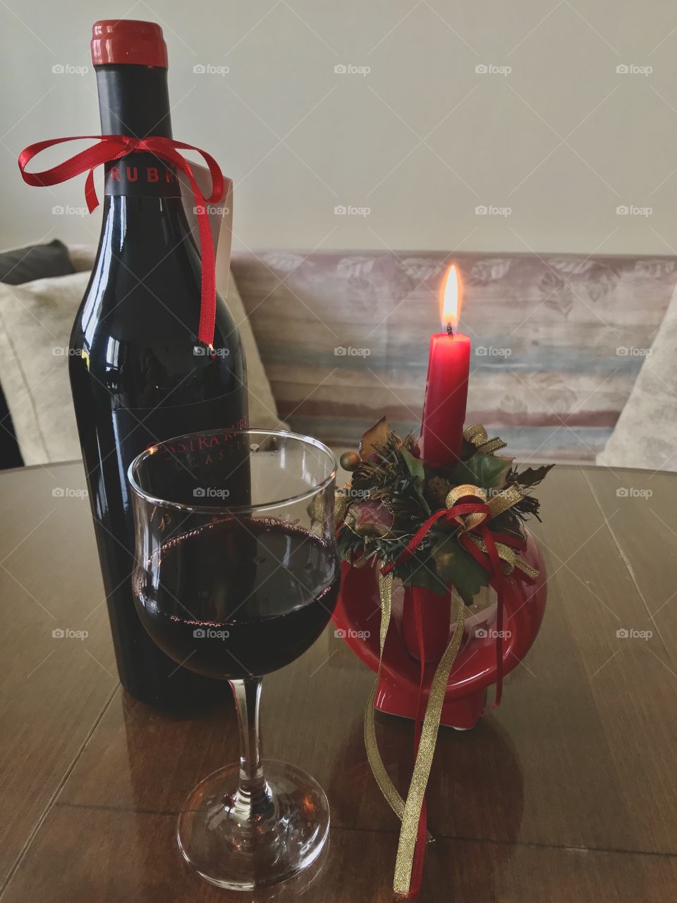 A bottle of wine and a romantic candle in the shape of a heart. ❤️