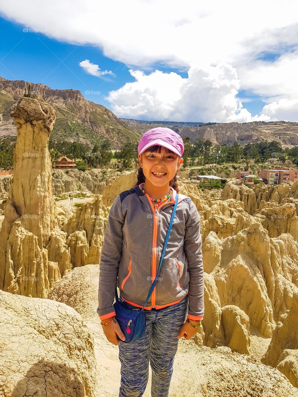 Smily girl among rocks