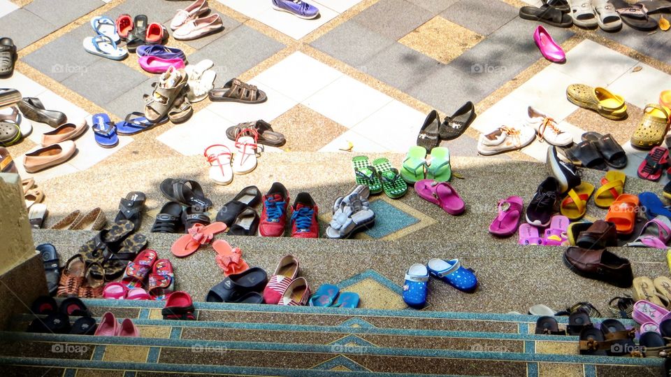 Lots  shoes outside  temple  in  Thailand 