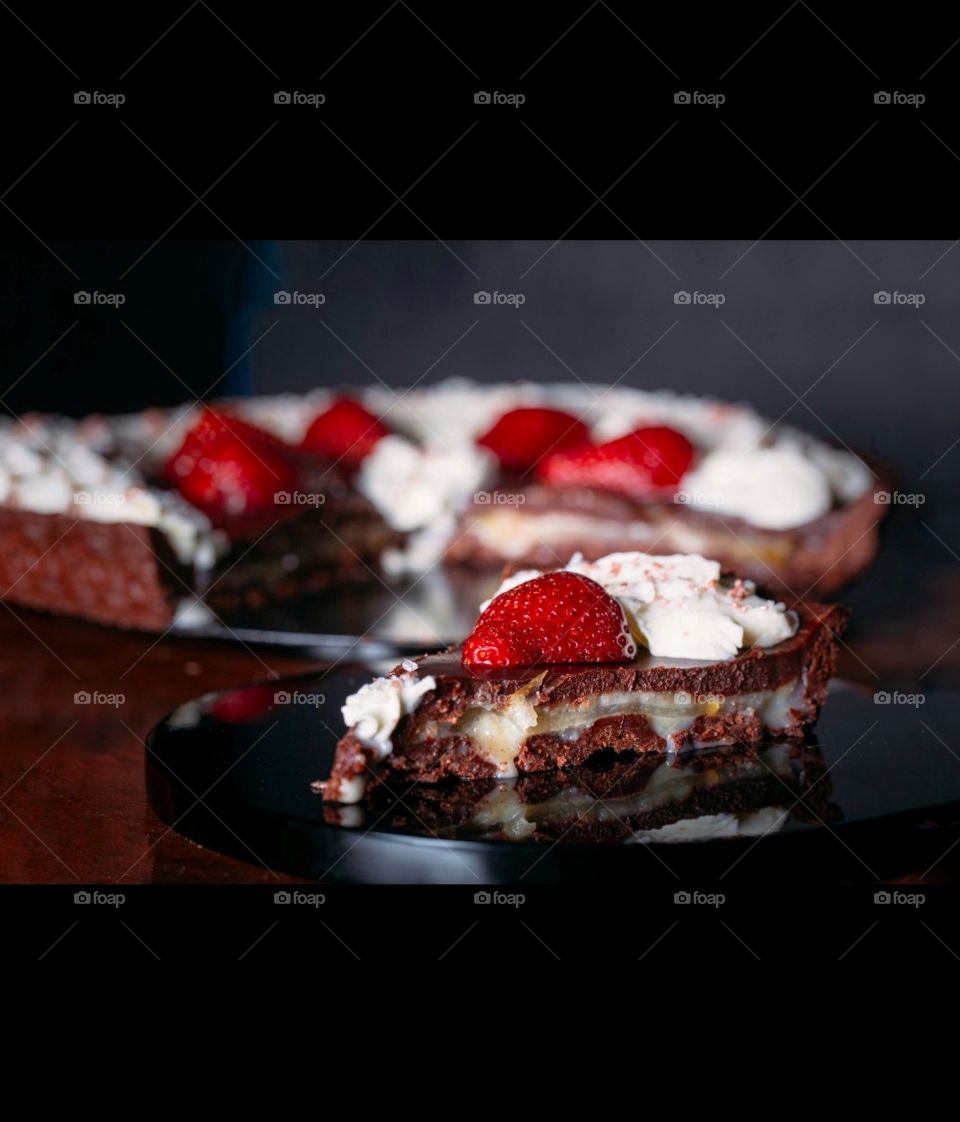 In this photo I captured mummy sweet chocolate layer dessert with some strawberry