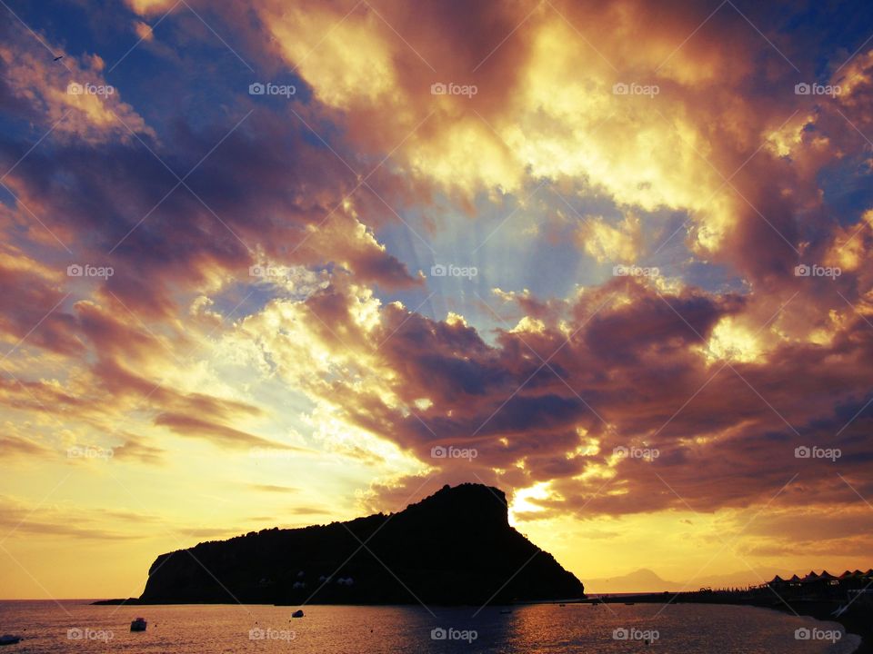 Dramatic sky over the sea at sunset