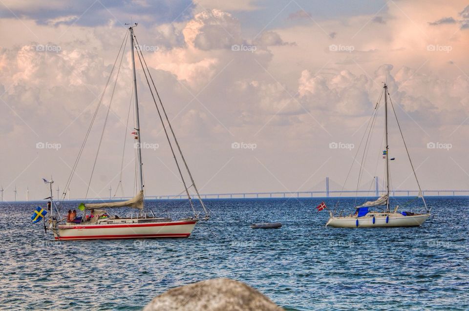 Sailboats sailing in sea