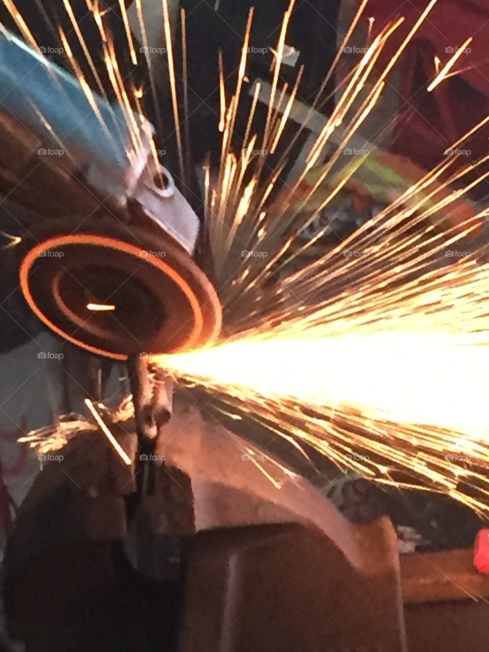 A grinder in motion can be a beautiful and colourful thing yet also a dangerous items you put into the wrong hands the sparks coming from the grinder makes an impressive photo